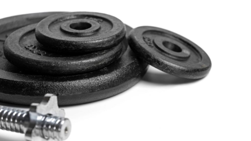 a couple of screws and a nut on a white surface